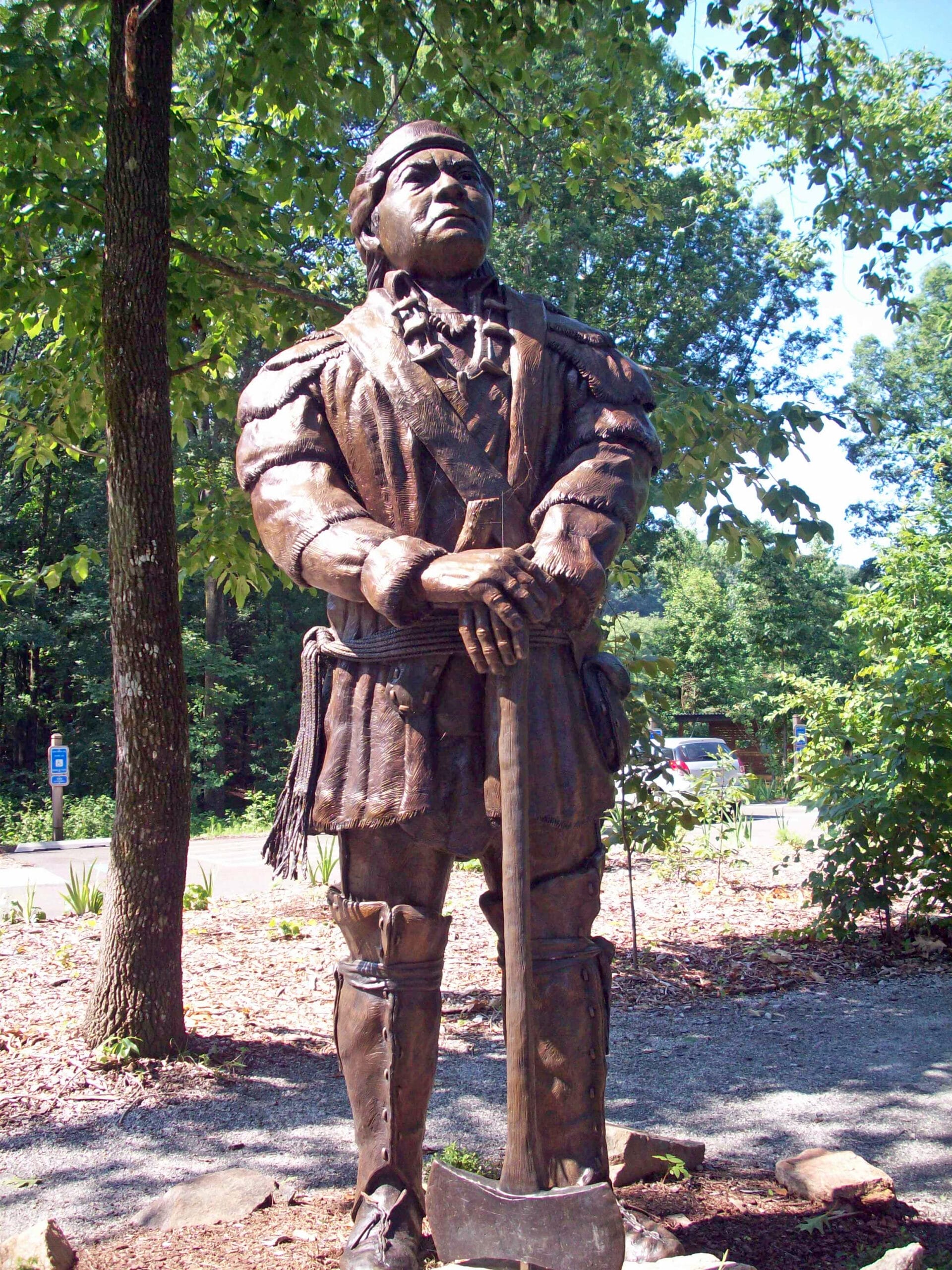 A statue of a man holding an axe.