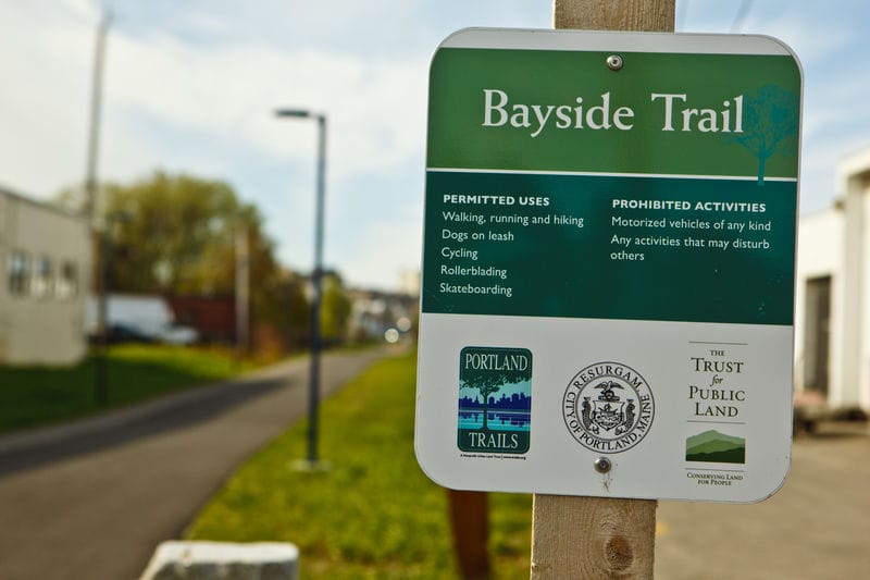 Bayside trail sign on a pole.
