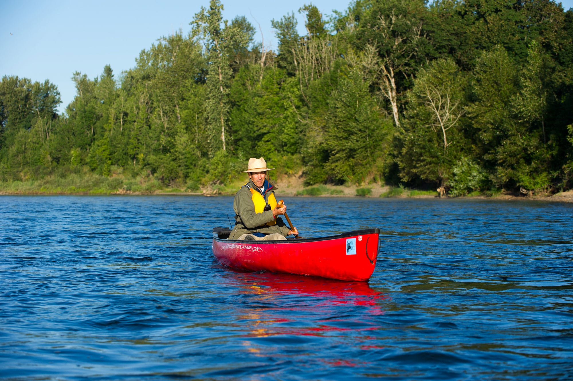 A man in a red canoe.