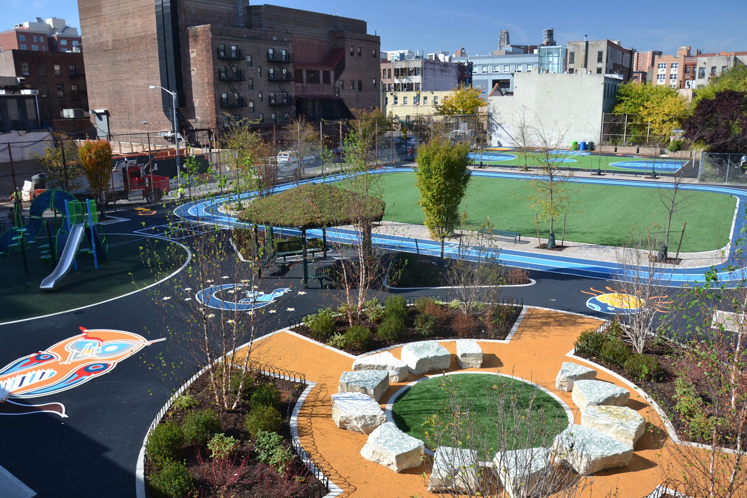 An aerial view of a playground in a city park.