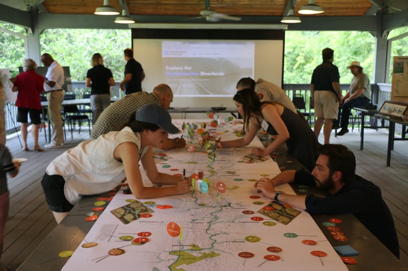 A group of people playing a board game.