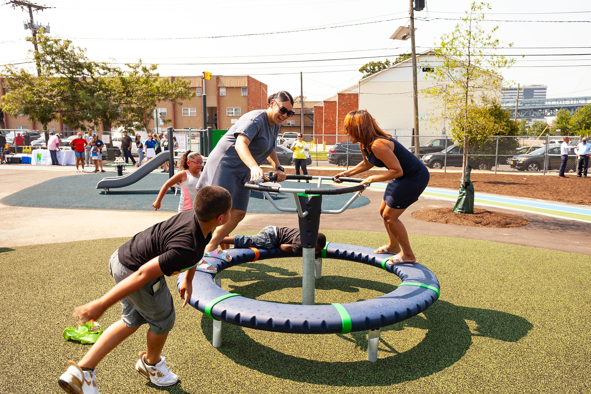 A group of people playing on a playground.