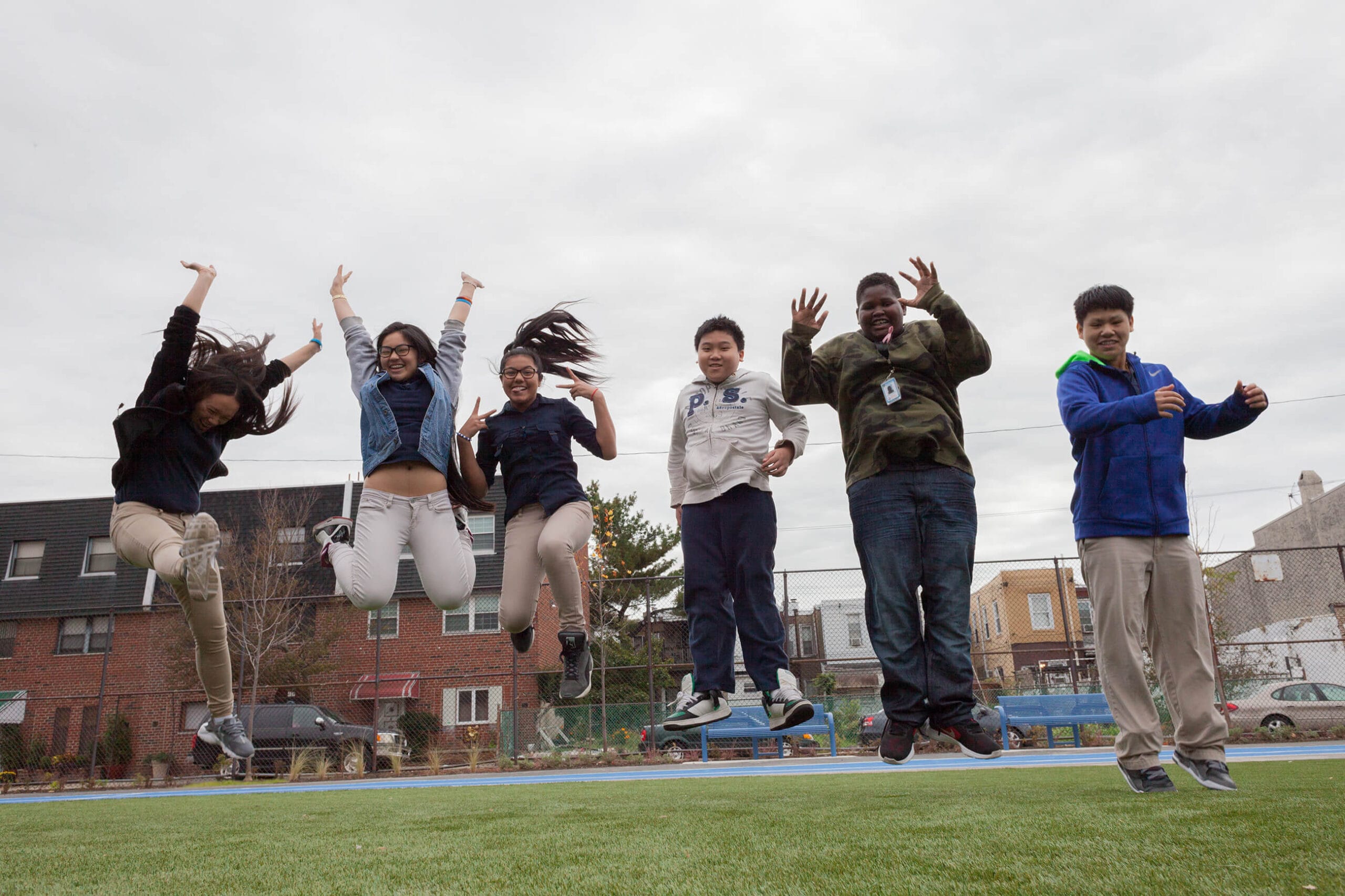 A group of people jumping in the air.