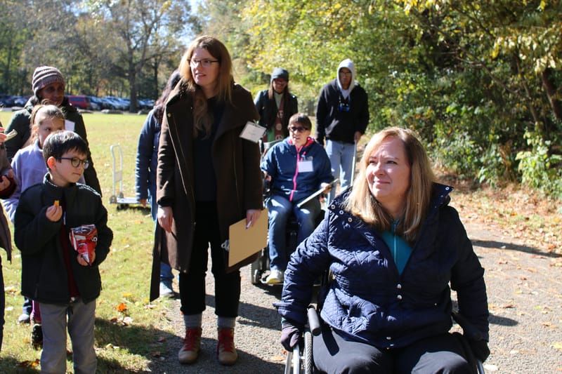 A woman in a wheelchair.