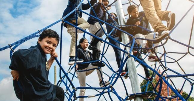 A group of children playing on a playground.