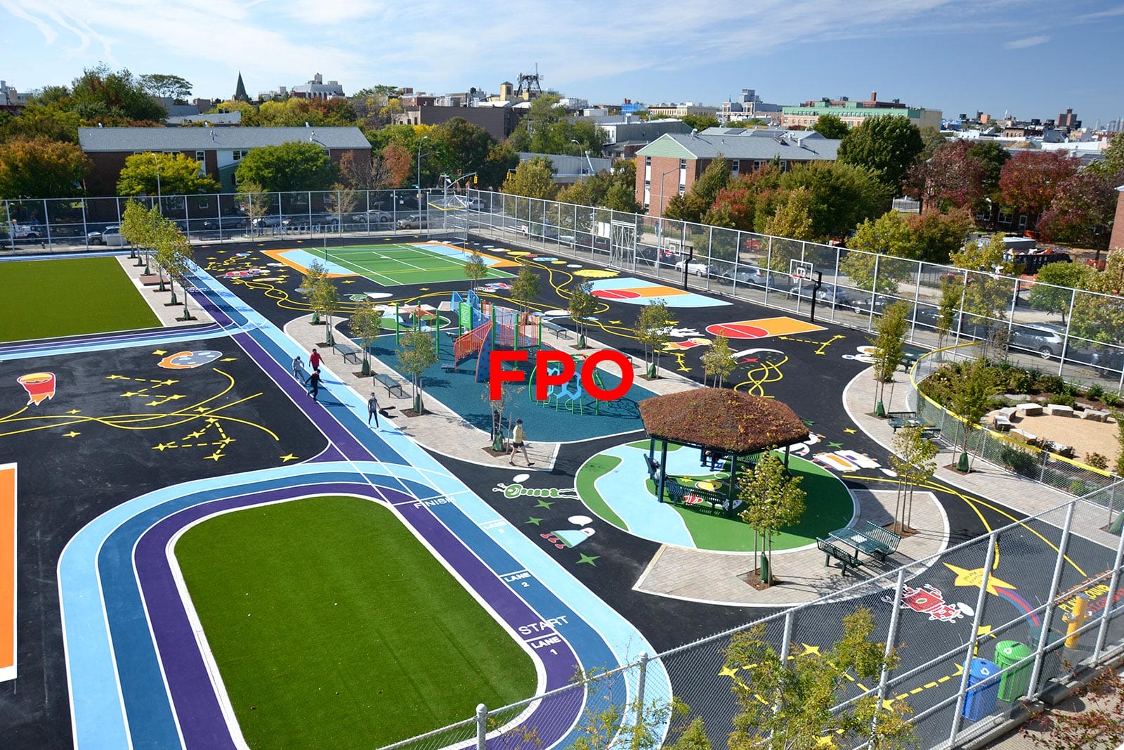 An aerial view of a playground with a basketball court.