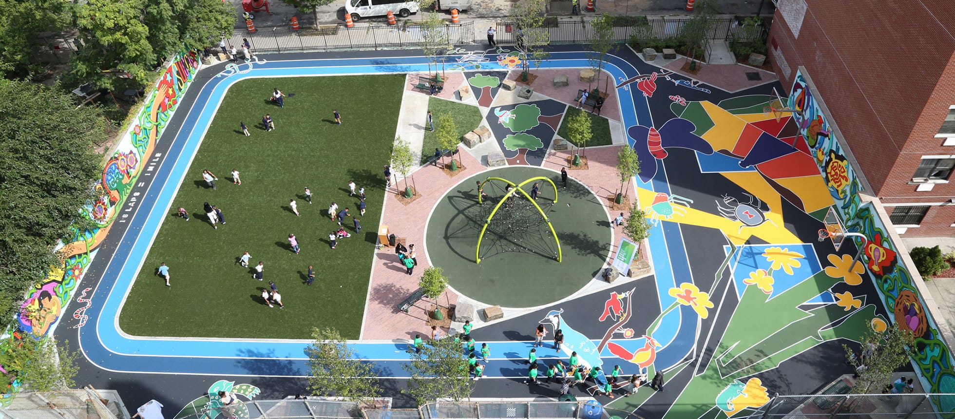 An aerial view of a playground with people playing on it.