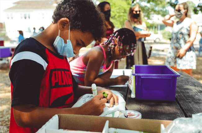 Providence youth making art in the park with an art kit created by P3.