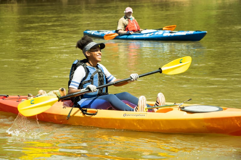 A woman in a kayak.