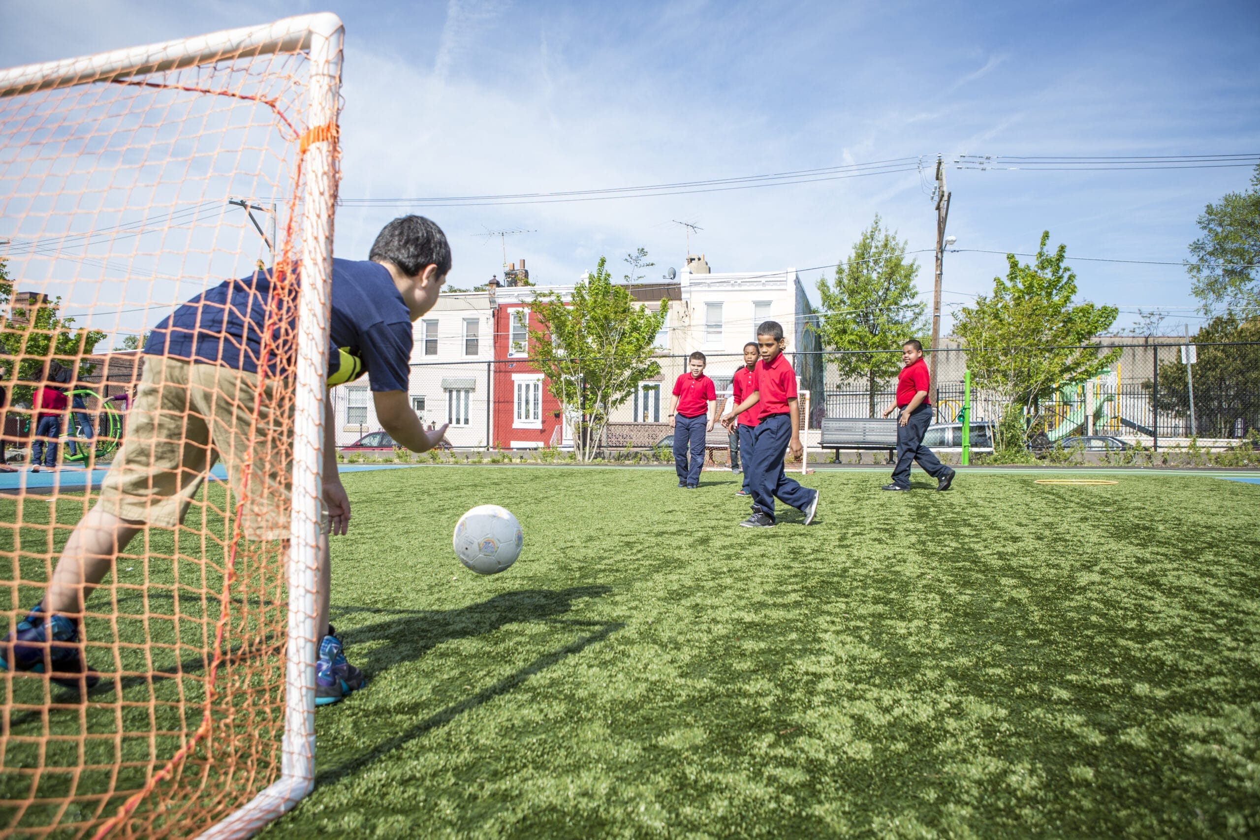 Kids playing soccer at the redesigned schoolyard at William Cramp Elementary School in Philadelphia. Photo: Jenna Stamm